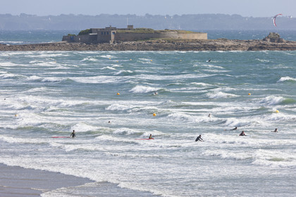Surfers enjoy the waves on the beach of Pen-er-Malo_Guidel
