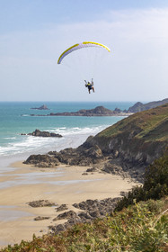 Paragliding along the cliffs of Plouha